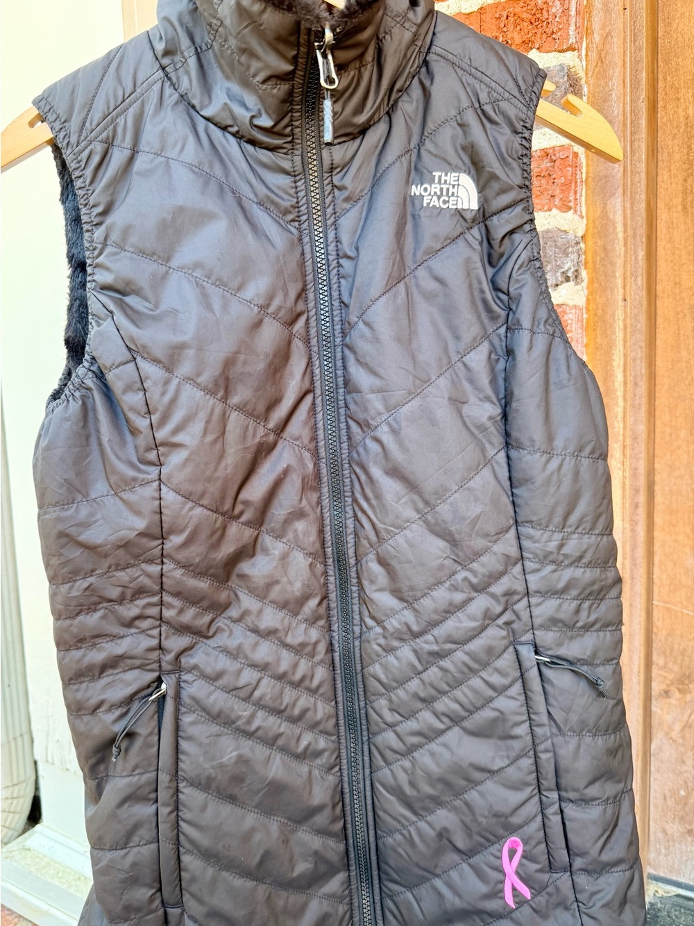The North Face Black Quilted Vest with Pink Ribbon Accent